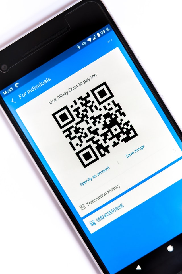 qr code sample in a persons hand